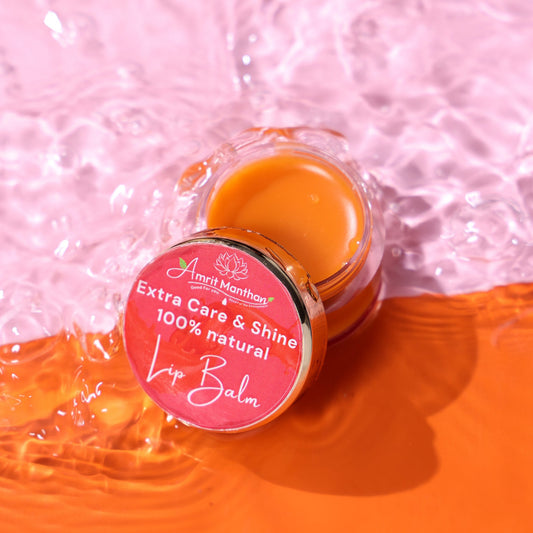 Lip balm jar with pink label on a pink and orange gradient background